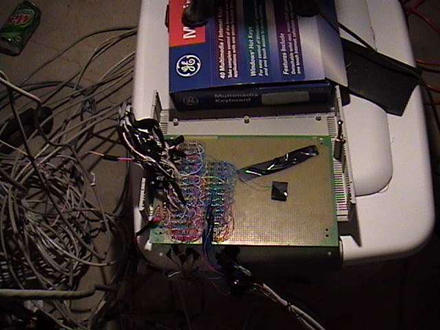 Early controller board installed in enclosure lid with wiring harness, 2002