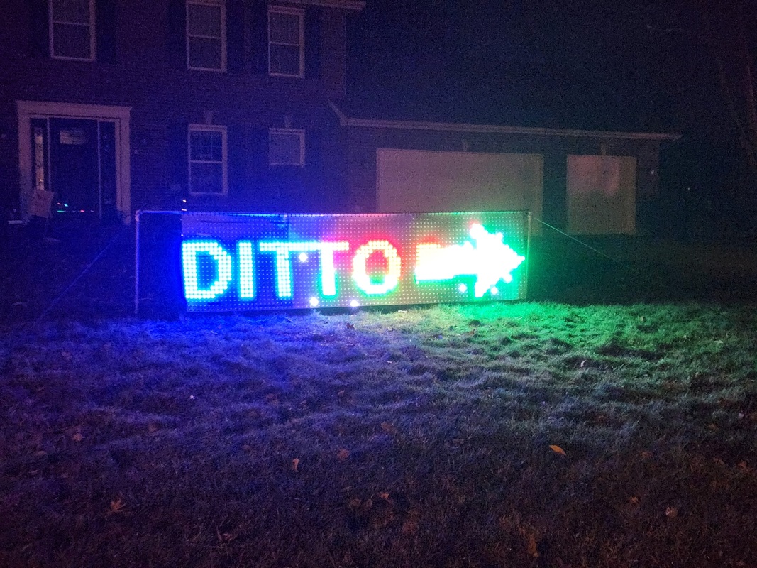 The Ditto sign directing visitors to the neighbor's display - Dec 3, 2022