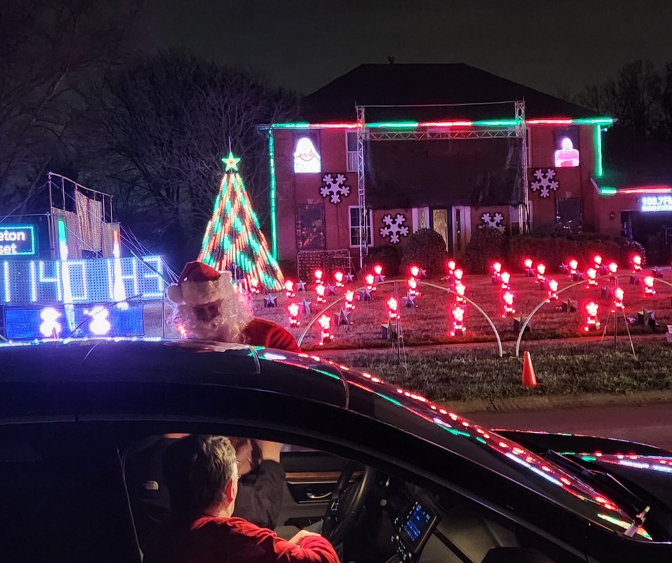 Santa greeting visitors at their cars - Dec 11, 2022