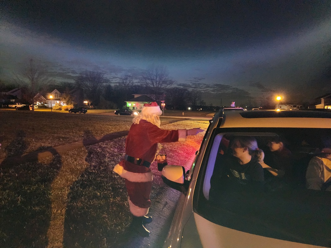 Santa handing out candy to visitors - Dec 24, 2023