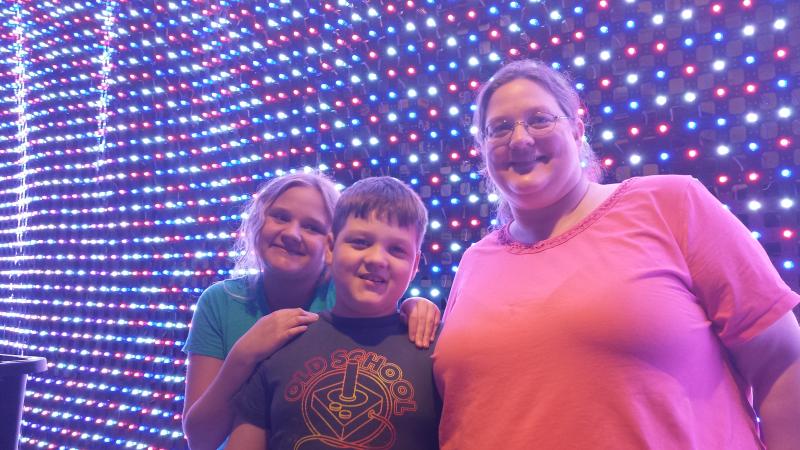 Family in Front of Grid